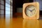 Wooden Clock on the Table with Japanese Bedroom Background,