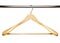 Wooden clothes hanger on metal crossbar isolated over white.