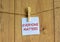 Wooden clothespin with white sheet of paper. Text `everyone matters`. Beautiful wooden background. Concept, copy space