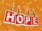 Wooden clothespins on rope with Hope