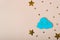 Wooden cloud and stars on beige background