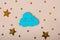 Wooden cloud and stars on beige background