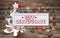 Wooden colorful christmas sign with text and decoration: gift ce