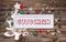 Wooden colorful christmas sign with text and decoration: gift ce