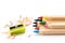 Wooden colorful pencils on a white background, pencil sharpeners