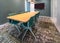 Wooden conference table and chairs in a corporate conference room