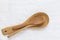 Wooden cooking spoons of different sizes on pure cotton linen table cloth. Culinary baking utensils artisan craftsmanship products