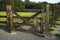 Wooden corral gate with horseshoe for good luck.