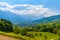 Wooden cottage houses on green fields, Grabs, Werdenberg, St. Gallen Switzerland