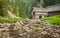 Wooden cottage in the mountains with creek