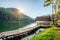 Wooden cottage on reservoir at sunset