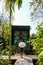 wooden cottage surrounded by palm trees and a vegetable garden in the countryside. cabin rainforest