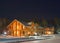 Wooden cottage under night sky