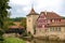 Wooden covered bridge and old tower in the historic center of Schw bisch Hall on the Kocher river, Baden-Wurttemberg, Germany