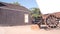 Wooden covered wagon on wheels, wild west pioneer ranch. Western farm or saloon.