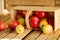 Wooden crate box full of fresh apples