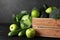 Wooden crate, fresh green fruits and vegetables