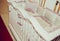 Wooden crib and retro silk bedding and pillows