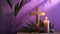 Wooden cross, candle and palm leaves on purple background