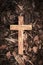 Wooden cross on dark wooden ground