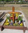 Wooden cross on the grave in the public cemetery