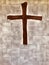 Wooden cross hanging on the brick wall in the christian church forbelief  worship and pray ,concept of  spiritual sign of savior ,