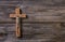 Wooden cross with jesus on a background for a obituary notice.