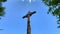 Wooden Cross On Mountain Peak after exhausting hike in summer