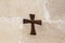 Wooden cross with number 3 - third stop of the Way of the Cross on the wall catholic Christian Transfiguration Church located on