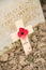 Wooden cross with a poppy for remembrance