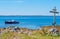 Wooden cross on shore of the White Sea at Anzersky Island. Solovky Islands, Russia