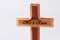 Wooden cross with text He is risen on grey background. Reminder of Jesus sacrifice and Christ resurrection. Easter passover.