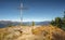 Wooden cross on the top of Gerlosstein in Austrian Alps with mountain panorama in the back on a sunny day of autumn with