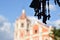 Wooden crucifixes hanging. Cathedral background. selective focus.