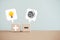 wooden cube blocks with plus and minus, a tangle of thoughts and brighten lightbulb on white speech bubble, for creative,