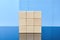 Wooden cubes on a blue background