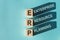 Wooden cubes building word ERP - abbreviation Enterprise Resource Planning on light blue background