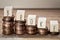 Wooden cubes with the word broke and pile of coins, money climbing stairs, business concept