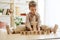 Wooden cubes with word RESPECT in hands of little boy