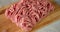 On a wooden cutting board raw minced meat.