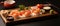 Wooden cutting board with sushi, vegetables California roll, a colorful dish