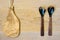 Wooden cutting board and utensils on wooden background