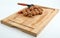Wooden cutting board with walnuts and nutcracker