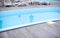 Wooden deck beach sea ocean resort sun lounger umbrella hotel pool sky sunrise.