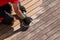 Wooden deck sanding with power sander tool, before after effect