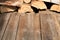 Wooden deck table with pile of firewood