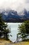 Wooden deck before turquoise Lake Pehoe and the Majestic Cuernos del Paine Horns of Paine