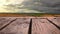 Wooden deck with a view of wide open fields