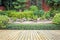 Wooden decking or flooring and plant in garden decorative