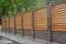 Wooden decorative fence around a garden